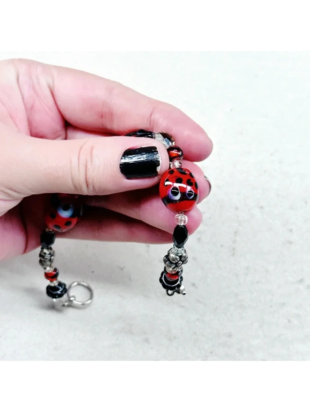 3011u. Silly Ladybug Glass Bracelet Silvertone